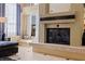 Elegant fireplace with a raised hearth and glass doors at 207 8Th E St, Tierra Verde, FL 33715