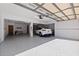 Spacious garage with Tesla charger and epoxy floor at 207 8Th E St, Tierra Verde, FL 33715