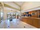 Open kitchen with island and breakfast nook, offering water views at 207 8Th E St, Tierra Verde, FL 33715