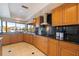 Spacious kitchen with granite countertops and wooden cabinets at 207 8Th E St, Tierra Verde, FL 33715