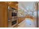 Well-equipped kitchen showcasing stainless steel appliances and ample cabinetry at 207 8Th E St, Tierra Verde, FL 33715