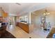 Open concept kitchen with breakfast bar, island, and granite countertops at 207 8Th E St, Tierra Verde, FL 33715
