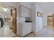 Laundry room with washer, dryer, storage, and a folding counter at 207 8Th E St, Tierra Verde, FL 33715