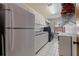 Functional laundry room with full-size appliances and ample storage at 207 8Th E St, Tierra Verde, FL 33715