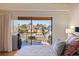 Bedroom with water views from sliding glass doors at 207 8Th E St, Tierra Verde, FL 33715