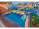 Inviting rectangular pool with brick patio and canal views at 207 8Th E St, Tierra Verde, FL 33715