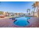 Inviting swimming pool with a spa and brick patio at 207 8Th E St, Tierra Verde, FL 33715