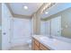Clean bathroom with a bathtub, shower, and wood vanity at 2131 Golden Oak Ln, Valrico, FL 33594