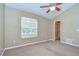 Well-lit bedroom with window, closet, and ceiling fan at 2131 Golden Oak Ln, Valrico, FL 33594