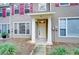 Two-story home's front entrance with white door and columns at 2131 Golden Oak Ln, Valrico, FL 33594