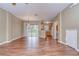 Open living room and kitchen area with hardwood floors at 2131 Golden Oak Ln, Valrico, FL 33594