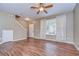 Living room with hardwood floors and access to the kitchen at 2131 Golden Oak Ln, Valrico, FL 33594