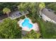 Community swimming pool with plenty of lounge chairs for relaxing at 2131 Golden Oak Ln, Valrico, FL 33594