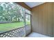Screened patio overlooking a large grassy backyard at 2131 Golden Oak Ln, Valrico, FL 33594