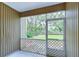 Screened-in porch overlooking a grassy backyard at 2131 Golden Oak Ln, Valrico, FL 33594