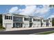 Modern 3-story townhouses with attached garages and neutral color palette at 2746 Pearly Banks Dr, Bradenton, FL 34208