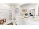 Bright bathroom features double sinks with marble countertops and a shower with white tile at 2762 Pearly Banks Dr, Bradenton, FL 34208