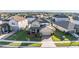 Aerial view of house and surrounding homes at 30868 Kelmin Ter, Wesley Chapel, FL 33543