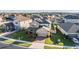Two-story house with landscaped yard, part of a larger community at 30868 Kelmin Ter, Wesley Chapel, FL 33543