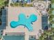 Community pool with surrounding deck and shade structures at 30868 Kelmin Ter, Wesley Chapel, FL 33543