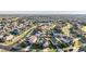 Large community with numerous houses and green spaces at 30868 Kelmin Ter, Wesley Chapel, FL 33543