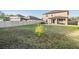 Large backyard with green grass and fence at 30868 Kelmin Ter, Wesley Chapel, FL 33543