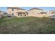 Spacious backyard with home view and fence at 30868 Kelmin Ter, Wesley Chapel, FL 33543