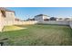 Large grassy backyard with privacy fence at 30868 Kelmin Ter, Wesley Chapel, FL 33543