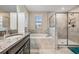 Bathroom with a soaking tub and walk-in shower at 30868 Kelmin Ter, Wesley Chapel, FL 33543