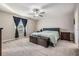 Spacious bedroom with carpet flooring and a ceiling fan at 30868 Kelmin Ter, Wesley Chapel, FL 33543