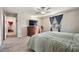 Large bedroom with a dresser and TV at 30868 Kelmin Ter, Wesley Chapel, FL 33543