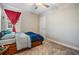 Cozy bedroom with a bed and window at 30868 Kelmin Ter, Wesley Chapel, FL 33543