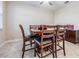 Casual dining area with wood table and chairs at 30868 Kelmin Ter, Wesley Chapel, FL 33543