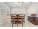 Dining room with a wood table and chairs, and a buffet at 30868 Kelmin Ter, Wesley Chapel, FL 33543