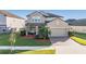 Two-story house with landscaped yard and two-car garage at 30868 Kelmin Ter, Wesley Chapel, FL 33543
