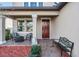 Front porch with seating and a decorative entrance at 30868 Kelmin Ter, Wesley Chapel, FL 33543