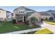 Two-story house with palm trees and landscaping at 30868 Kelmin Ter, Wesley Chapel, FL 33543
