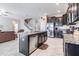 Open kitchen with large island and stainless steel appliances at 30868 Kelmin Ter, Wesley Chapel, FL 33543