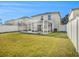 Spacious backyard with screened patio and grassy area at 32328 Fish Hook Loop, Wesley Chapel, FL 33545