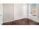 Bedroom with double doors and a window at 32328 Fish Hook Loop, Wesley Chapel, FL 33545