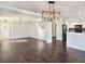 Open dining room with hardwood floors and chandelier at 32328 Fish Hook Loop, Wesley Chapel, FL 33545