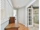 Upstairs hallway with wood floors and plantation shutters at 3314 W Barcelona St, Tampa, FL 33629