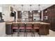 Modern kitchen with dark cabinetry and granite countertops at 3314 W Barcelona St, Tampa, FL 33629