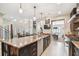 Large kitchen with island, stainless steel appliances, and granite countertops at 3314 W Barcelona St, Tampa, FL 33629