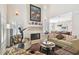 Living room with fireplace and view into dining area at 3314 W Barcelona St, Tampa, FL 33629