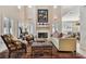 Spacious living room with a fireplace and seating area at 3314 W Barcelona St, Tampa, FL 33629