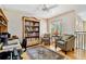 Home office with built-in bookcase, hardwood floors, and a desk at 3314 W Barcelona St, Tampa, FL 33629