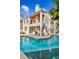 Stunning pool with spacious patio and two-story home in background at 3314 W Barcelona St, Tampa, FL 33629