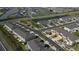 Aerial view of townhouses community with lake and roads at 34196 Polacca Ln, Wesley Chapel, FL 33543