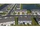 Aerial view of townhouses community near a lake at 34196 Polacca Ln, Wesley Chapel, FL 33543